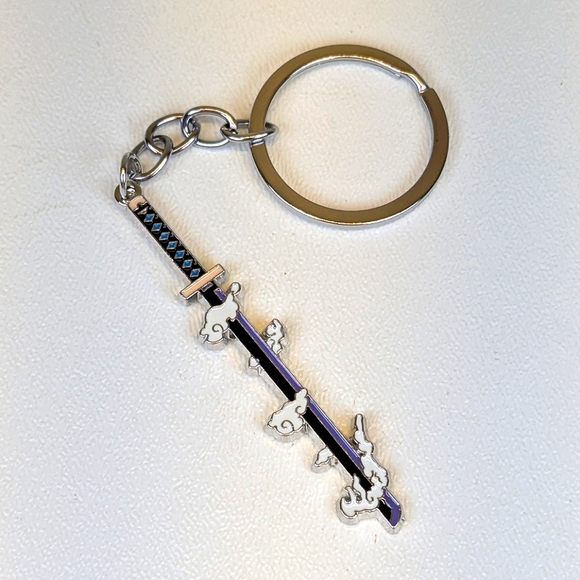 Demon Slayer: Kimetsu no Yaiba Sword Keychain Purple & Black Clouds - Picture 1 of 3